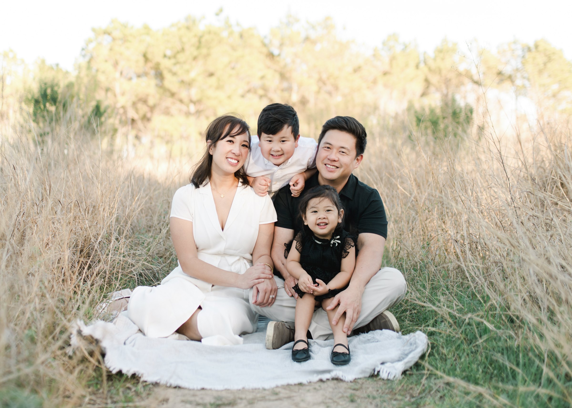 Dr. Tam Nguyen and Dr. William Sung with their two children