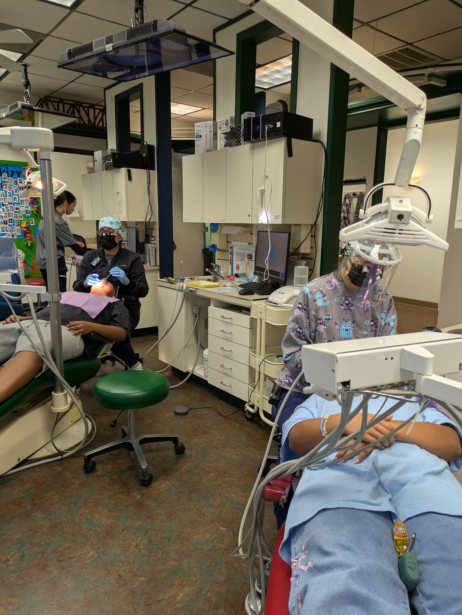 A treatment room with a patient in the chair