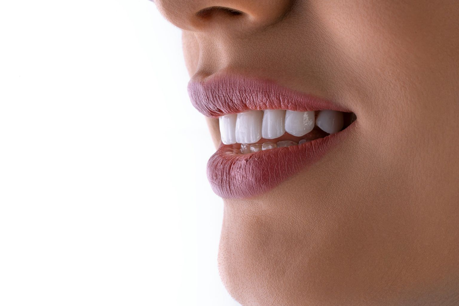A close smile in profile