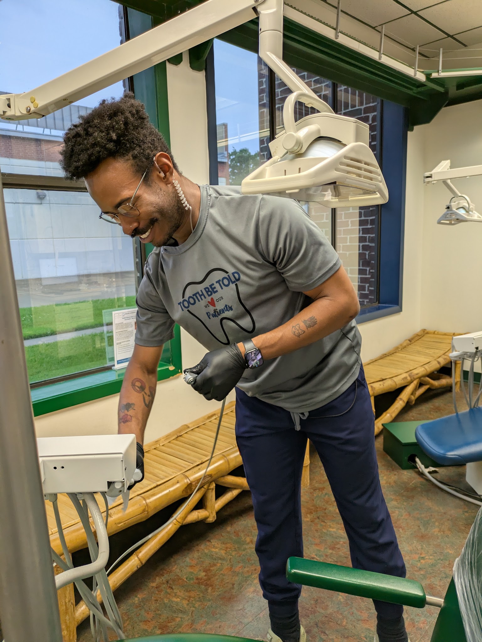 A dentist with the handheld x-ray unit